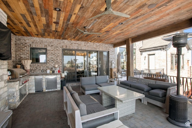 9632 N 5650 W, Highland, UT 84003 - view of patio with ceiling fan, a grill, an outdoor hangout area, and exterior kitchen