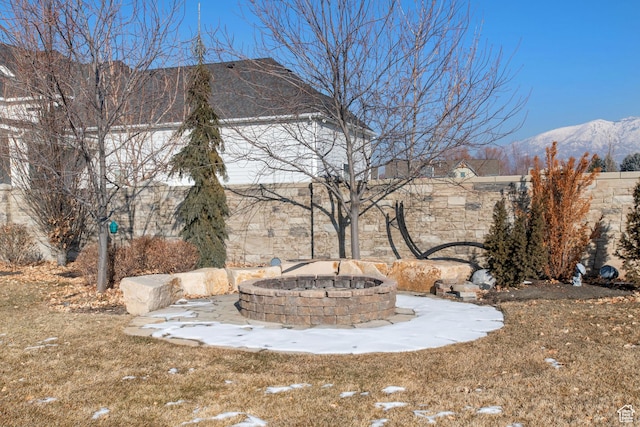 9632 N 5650 W, Highland, UT 84003 - snowy yard featuring an outdoor fire pit and a mountain view