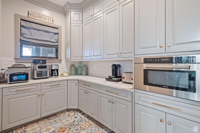 9632 N 5650 W, Highland, UT 84003 - kitchen featuring light stone counters, backsplash, ornamental molding, and oven