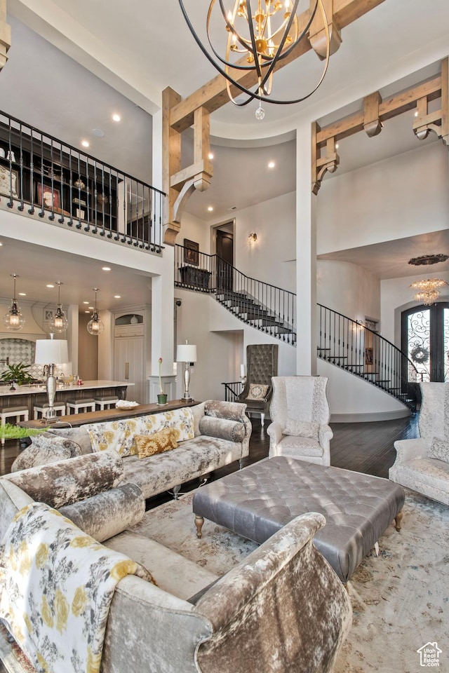 9632 N 5650 W, Highland, UT 84003 - living room with an inviting chandelier, a towering ceiling, and wood-type flooring