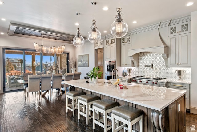 9632 N 5650 W, Highland, UT 84003 - kitchen with a large island, pendant lighting, custom range hood, and a breakfast bar