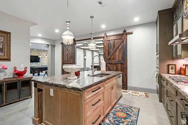 9632 N 5650 W, Highland, UT 84003 - kitchen with sink, stainless steel appliances, a center island with sink, decorative light fixtures, and a barn door