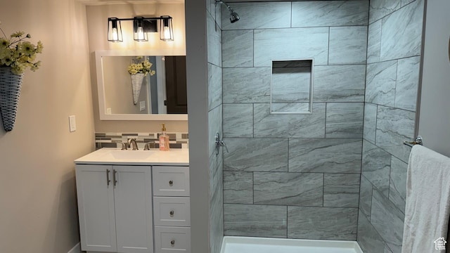 bathroom featuring vanity and a tile shower