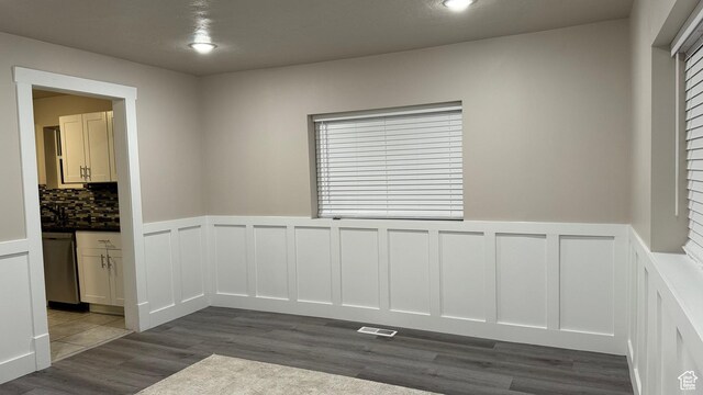 empty room with dark hardwood / wood-style flooring