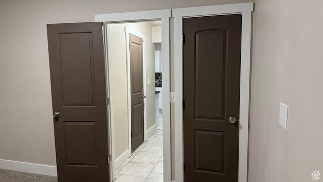 hall with light tile patterned flooring