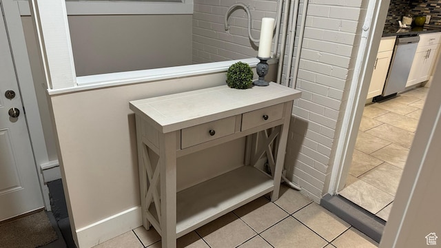 room details featuring dishwasher and decorative backsplash