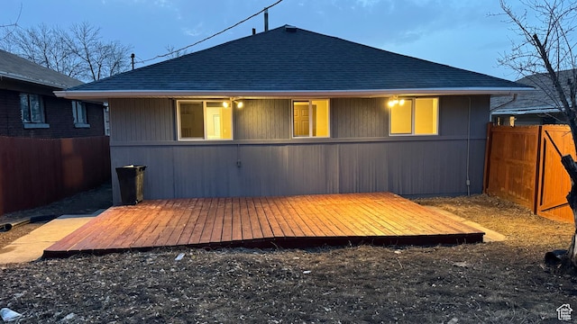 rear view of house with a wooden deck