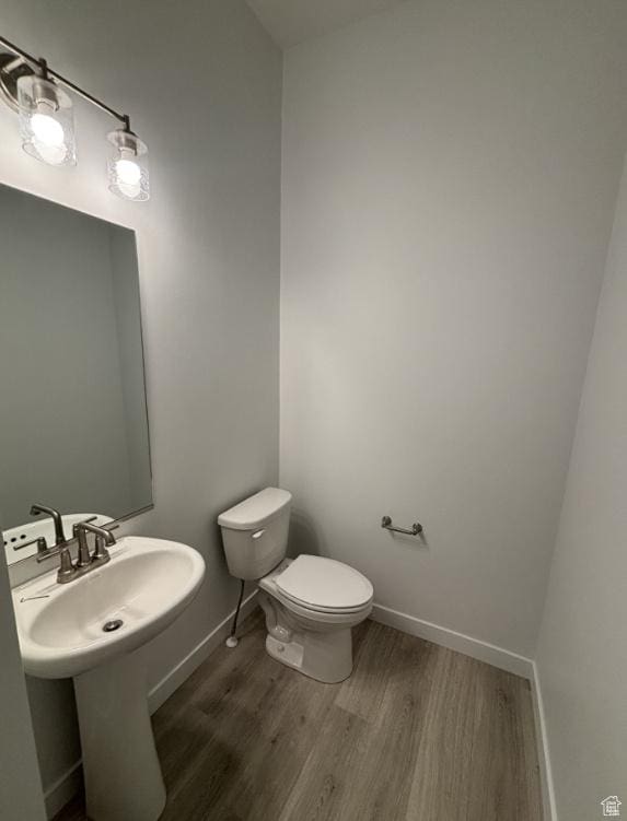 284 E Polaris Dr Unit 112, Saratoga Springs, UT 84045 - bathroom with wood-type flooring, sink, and toilet