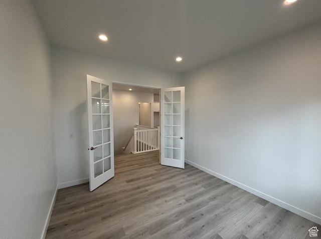 284 E Polaris Dr Unit 112, Saratoga Springs, UT 84045 - unfurnished room featuring wood-type flooring and french doors