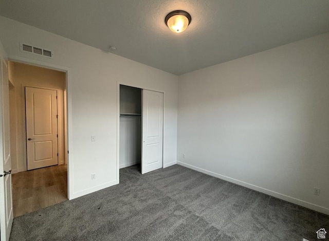 284 E Polaris Dr Unit 112, Saratoga Springs, UT 84045 - unfurnished bedroom featuring dark carpet and a closet