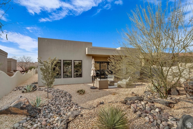2090 N Tuweap Dr Unit 56, St George, UT 84770 - back of property featuring stucco siding and a patio