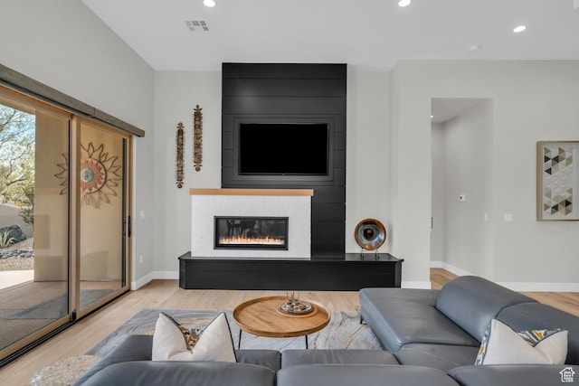 2090 N Tuweap Dr Unit 56, St George, UT 84770 - living room with a large fireplace and light wood-type flooring