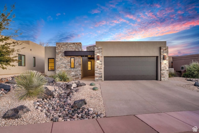 southwest-style home with a garage