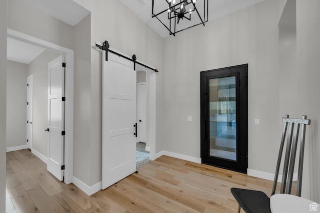 2090 N Tuweap Dr Unit 56, St George, UT 84770 - foyer with a barn door, a notable chandelier, and light wood-type flooring