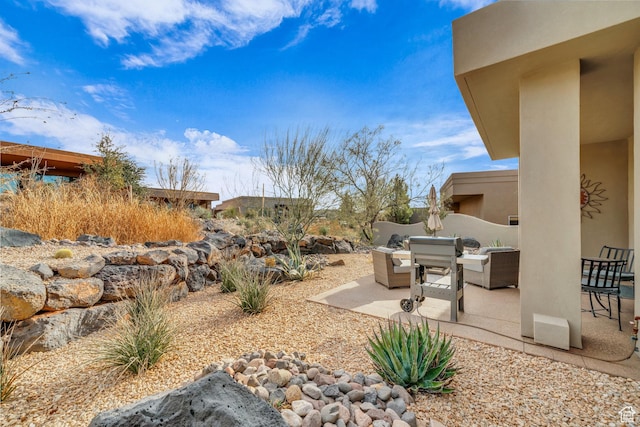 2090 N Tuweap Dr Unit 56, St George, UT 84770 - view of yard with a patio area and outdoor lounge area