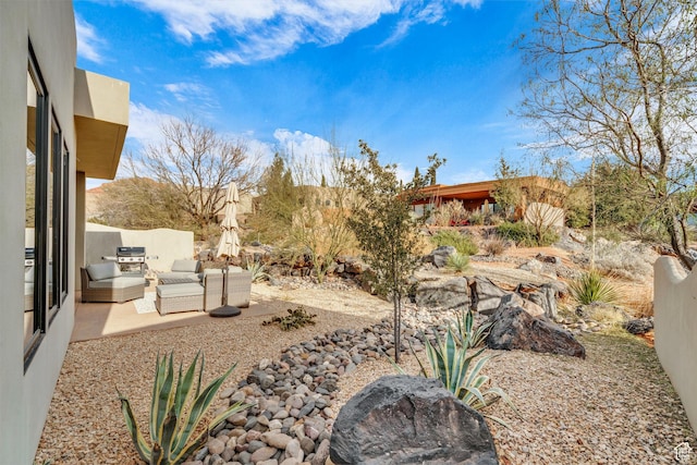 2090 N Tuweap Dr Unit 56, St George, UT 84770 - view of yard featuring a patio and outdoor lounge area