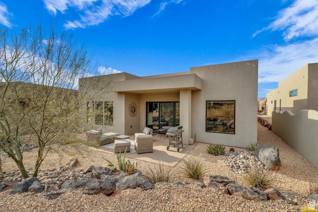2090 N Tuweap Dr Unit 56, St George, UT 84770 - rear view of property with a patio and an outdoor hangout area