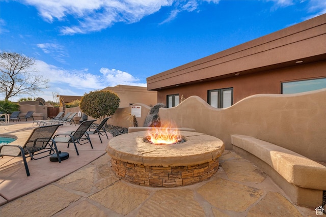 2090 N Tuweap Dr Unit 56, St George, UT 84770 - view of patio with an outdoor fire pit