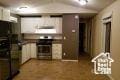 754 Cessna Ct, Spring Creek, NV 89815 - kitchen featuring white cabinetry