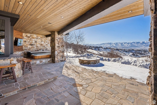 8435 N Ranch Garden Rd, Park City, UT 84098 - snow covered patio with a covered hot tub, a mountain view, and a patio area