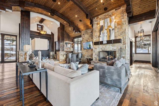 8435 N Ranch Garden Rd, Park City, UT 84098 - living area featuring wood ceiling with exposed beams, hardwood / wood-style flooring, healthy amount of natural light, a stone fireplace, and high vaulted ceiling