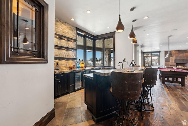 8435 N Ranch Garden Rd, Park City, UT 84098 - indoor wet bar with recessed lighting, baseboards, hanging light fixtures, and wine cooler