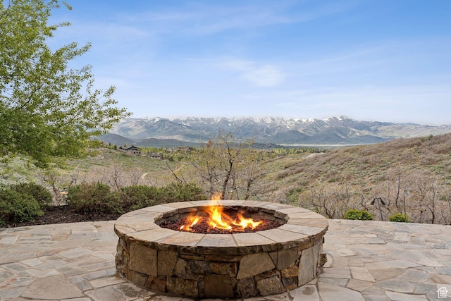 8435 N Ranch Garden Rd, Park City, UT 84098 - view of patio / terrace with an outdoor fire pit and a mountain view
