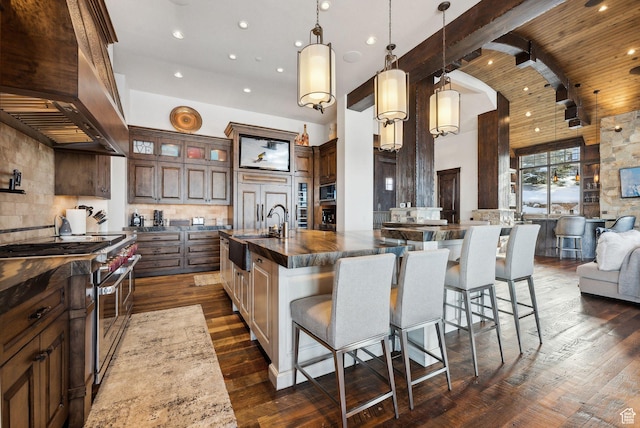 8435 N Ranch Garden Rd, Park City, UT 84098 - kitchen with double oven range, a sink, ventilation hood, decorative backsplash, and open floor plan