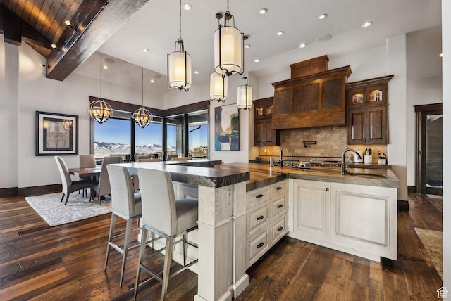 8435 N Ranch Garden Rd, Park City, UT 84098 - kitchen with a sink, dark countertops, beam ceiling, dark wood finished floors, and glass insert cabinets