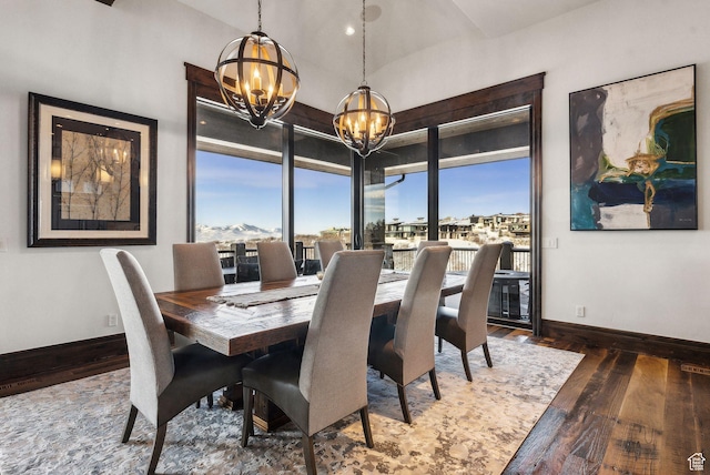 8435 N Ranch Garden Rd, Park City, UT 84098 - dining area with a chandelier, wood-type flooring, baseboards, and vaulted ceiling