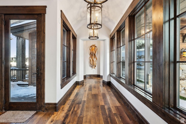 8435 N Ranch Garden Rd, Park City, UT 84098 - hall with baseboards, dark wood-style flooring, a chandelier, and healthy amount of natural light