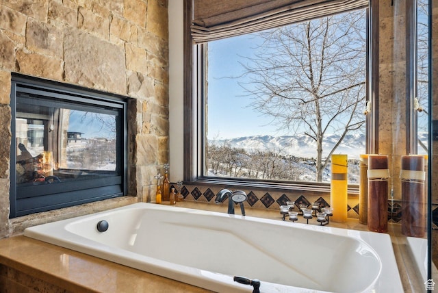 8435 N Ranch Garden Rd, Park City, UT 84098 - bathroom with a mountain view, a multi sided fireplace, and a bath