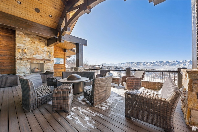 8435 N Ranch Garden Rd, Park City, UT 84098 - wooden terrace with an outdoor stone fireplace, a mountain view, and outdoor dining area