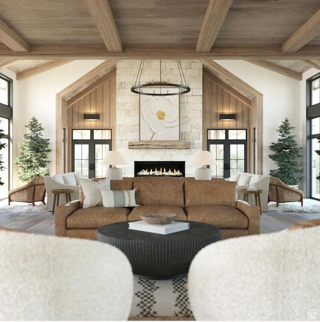 living room with wooden ceiling, a fireplace, beam ceiling, and french doors