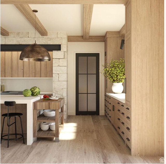 interior space featuring beamed ceiling and light hardwood / wood-style flooring