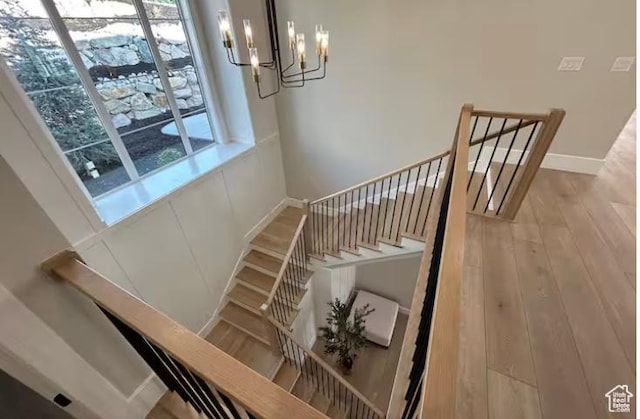 208 W Stone Gate Ln, Provo, UT 84604 - staircase with a chandelier, wood finished floors, and baseboards