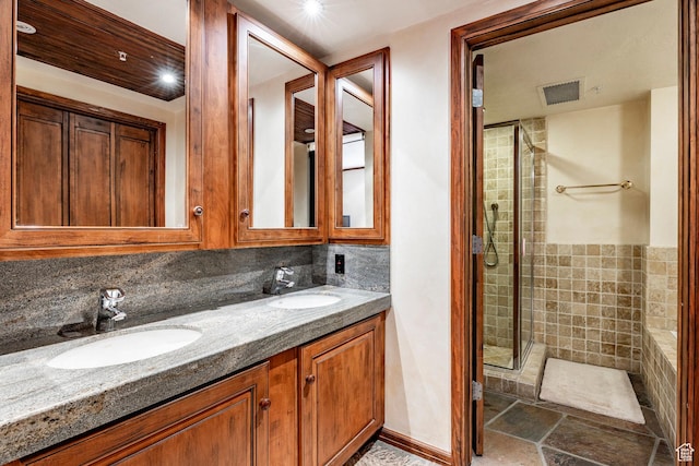 751 Main St Unit 415, Park City, UT 84060 - bathroom featuring a shower with door, vanity, and backsplash