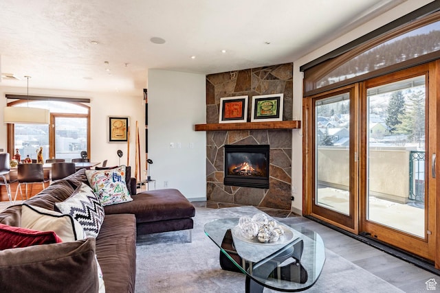 751 Main St Unit 415, Park City, UT 84060 - living room featuring a stone fireplace and hardwood / wood-style floors