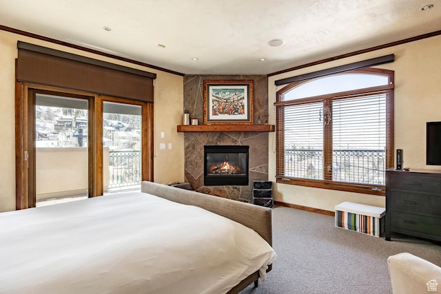 751 Main St Unit 415, Park City, UT 84060 - bedroom with a fireplace, ornamental molding, access to exterior, and carpet