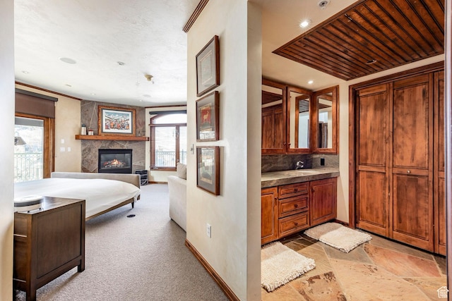 751 Main St Unit 415, Park City, UT 84060 - bathroom with vanity, a fireplace, and backsplash