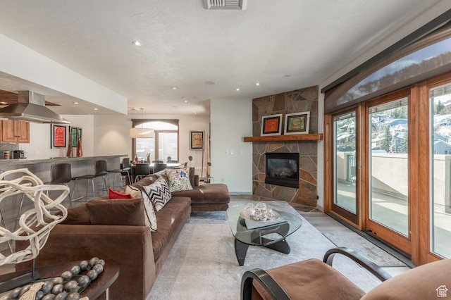 751 Main St Unit 415, Park City, UT 84060 - living room with a stone fireplace and a wealth of natural light