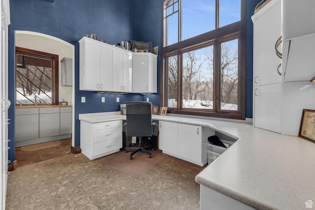 4230 Moosehollow Rd, Park City, UT 84098 - home office with a towering ceiling, a healthy amount of sunlight, and built in desk