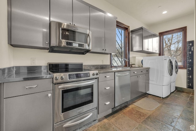 4230 Moosehollow Rd, Park City, UT 84098 - kitchen featuring gray cabinets, sink, stainless steel counters, washing machine and clothes dryer, and stainless steel appliances
