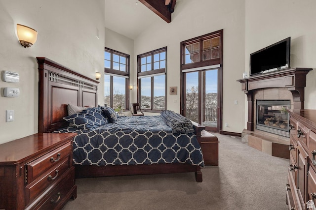 4230 Moosehollow Rd, Park City, UT 84098 - carpeted bedroom with beamed ceiling, a tile fireplace, a towering ceiling, and access to outside