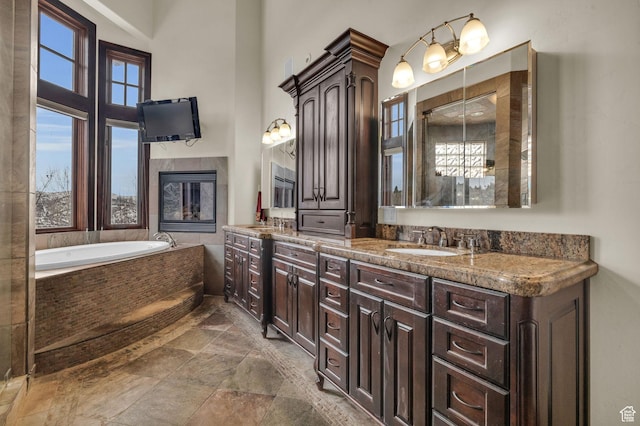 4230 Moosehollow Rd, Park City, UT 84098 - bathroom with a high ceiling, vanity, and a relaxing tiled tub