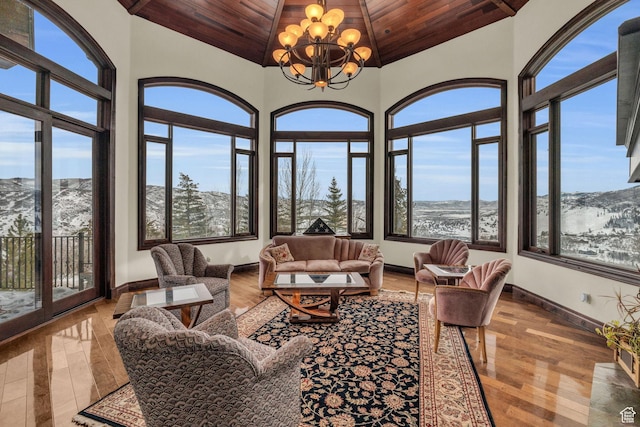4230 Moosehollow Rd, Park City, UT 84098 - sunroom with lofted ceiling, a notable chandelier, wood ceiling, and a healthy amount of sunlight