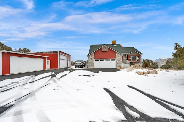 view of front of house featuring a garage and a mountain view