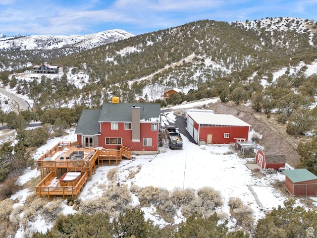 snowy aerial view featuring a mountain view