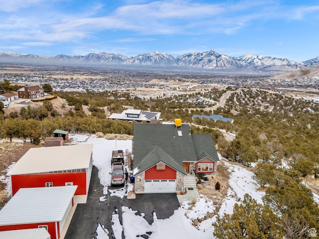 snowy aerial view with a mountain view