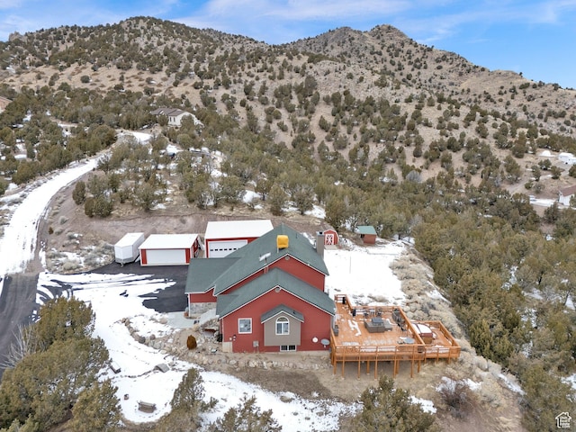 snowy aerial view featuring a mountain view